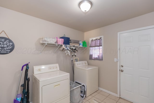 1910 S Seminole St, Amarillo, TX 79103 - laundry room with washer and clothes dryer and light tile patterned floors