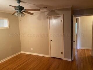 2237 Locust St, Amarillo, TX 79109 - unfurnished bedroom with wood finished floors and baseboards