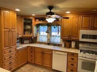 2237 Locust St, Amarillo, TX 79109 - kitchen with white appliances, ceiling fan, a sink, light countertops, and recessed lighting