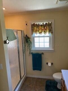 2237 Locust St, Amarillo, TX 79109 - full bath with vanity, toilet, a shower stall, and baseboards