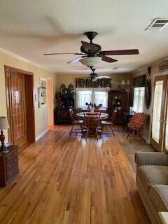 2237 Locust St, Amarillo, TX 79109 - dining area featuring ceiling fan, wood finished floors, and crown molding