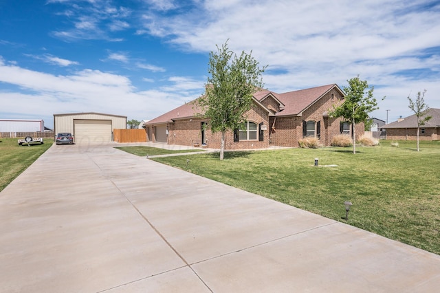 9152 E Hey Jude Ln, Amarillo, TX 79119 - single story home featuring driveway, brick siding, an outdoor structure, a detached garage, and a front lawn