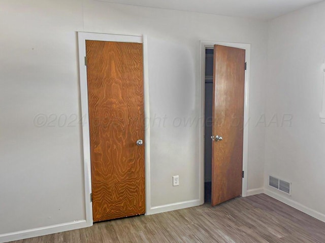 1610 Jordan St, Amarillo, TX 79106 - unfurnished bedroom with wood finished floors and baseboards