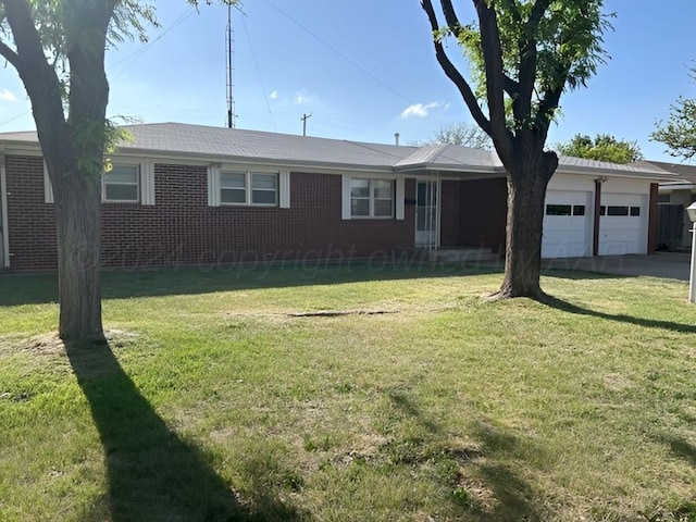 1610 Jordan St, Amarillo, TX 79106 - single story home with an attached garage, a front lawn, and brick siding