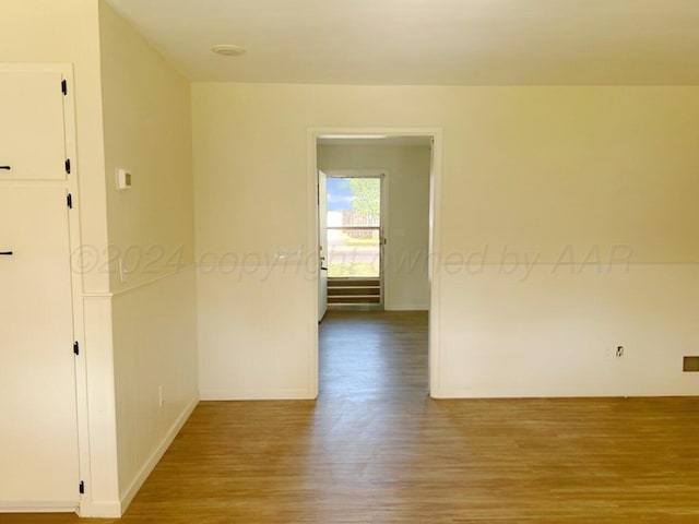 unfurnished room with light hardwood / wood-style floors