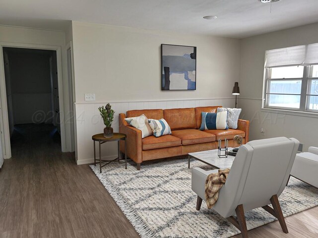 1610 Jordan St, Amarillo, TX 79106 - living room with wood finished floors and wainscoting
