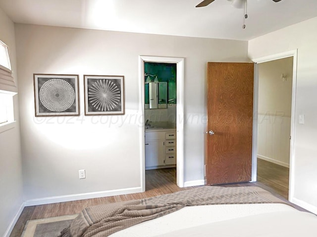 1610 Jordan St, Amarillo, TX 79106 - unfurnished bedroom featuring wood finished floors, connected bathroom, and ceiling fan