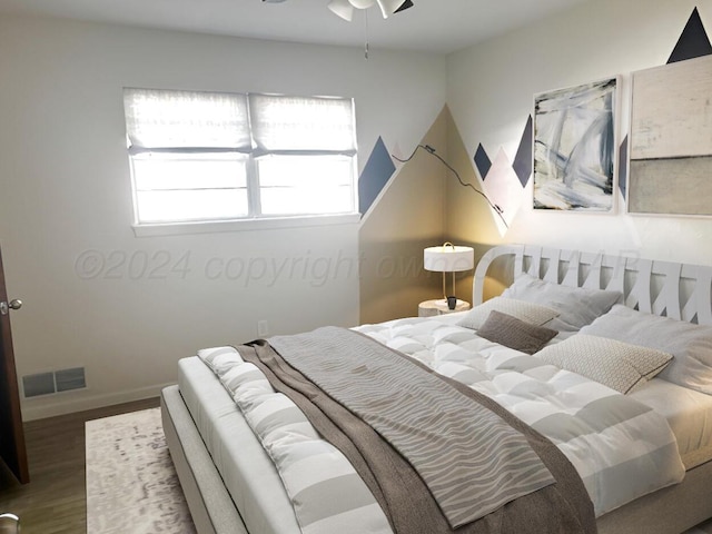 bedroom featuring ceiling fan and wood-type flooring