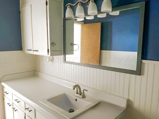 1610 Jordan St, Amarillo, TX 79106 - bathroom featuring wainscoting and vanity