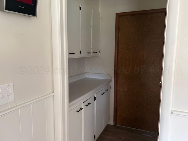 1610 Jordan St, Amarillo, TX 79106 - kitchen with light countertops, white cabinets, and wood finished floors