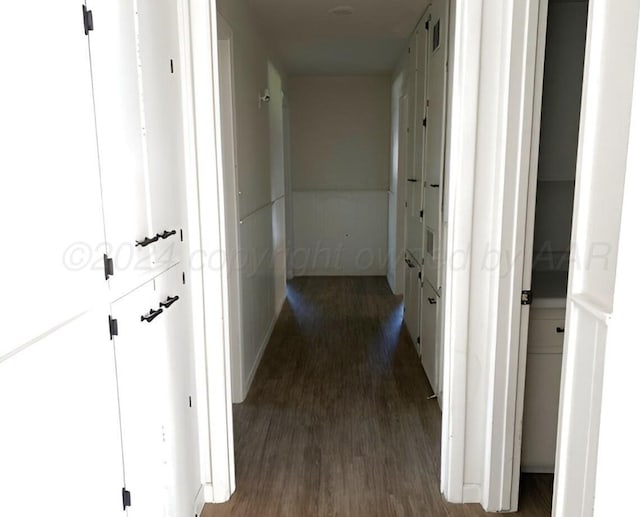 hallway with dark wood-type flooring