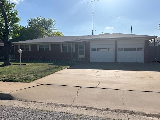1610 Jordan St, Amarillo, TX 79106 - ranch-style home featuring a front yard and an attached garage