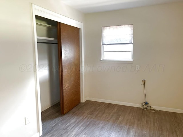 1610 Jordan St, Amarillo, TX 79106 - unfurnished bedroom featuring wood finished floors and a closet