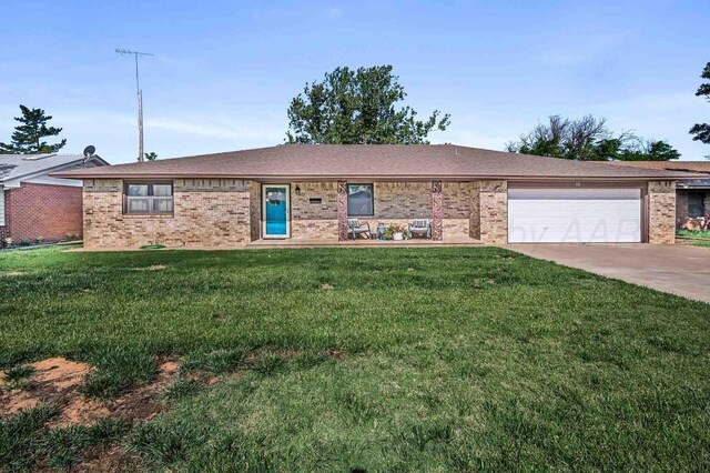 15 Fannin Dr, Tulia, TX 79088 - ranch-style home with brick siding, an attached garage, driveway, and a front yard