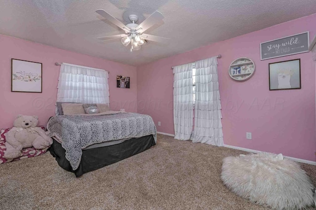 15 Fannin Dr, Tulia, TX 79088 - bedroom with carpet floors, a textured ceiling, baseboards, and ceiling fan