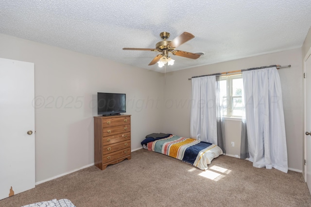 707 N Arkansas St, Shamrock, TX 79079 - carpeted bedroom with a textured ceiling and a ceiling fan