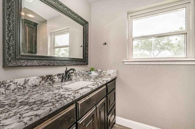 5800 Hester Rd, Amarillo, TX 79124 - bathroom with vanity and baseboards