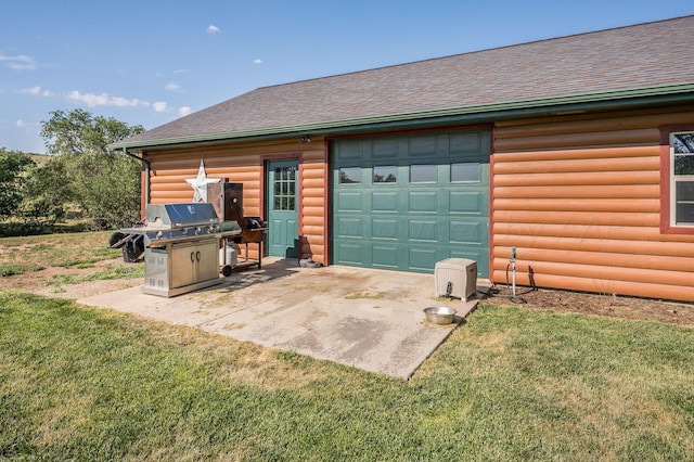 exterior space with a lawn, a shingled roof, and a garage