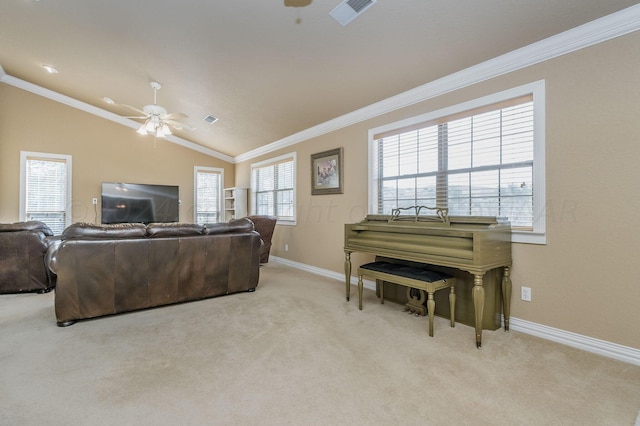 carpeted living room with crown molding, ceiling fan, vaulted ceiling, and baseboards