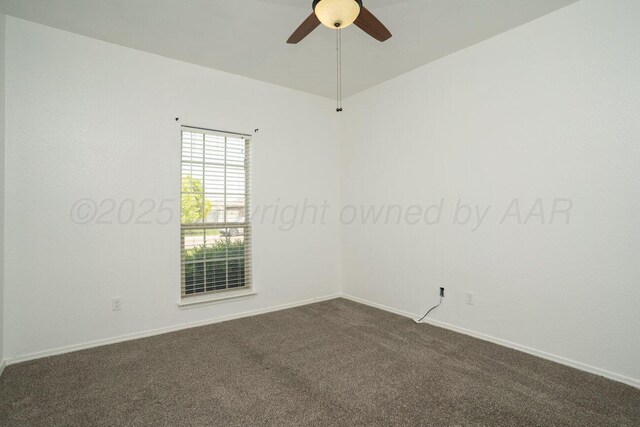 9909 Asher Ave, Amarillo, TX 79119 - empty room featuring dark colored carpet, a ceiling fan, and baseboards