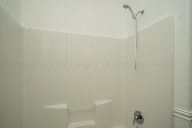 9909 Asher Ave, Amarillo, TX 79119 - bathroom featuring bathing tub / shower combination