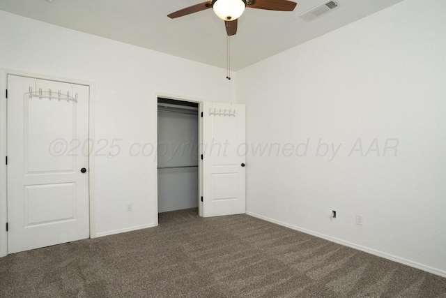 9909 Asher Ave, Amarillo, TX 79119 - unfurnished bedroom with dark carpet, baseboards, two closets, and a ceiling fan