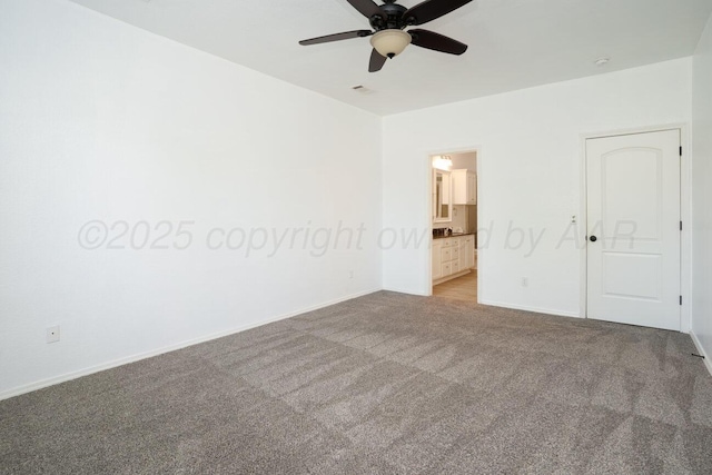 9909 Asher Ave, Amarillo, TX 79119 - unfurnished bedroom with carpet floors, baseboards, ensuite bathroom, and ceiling fan