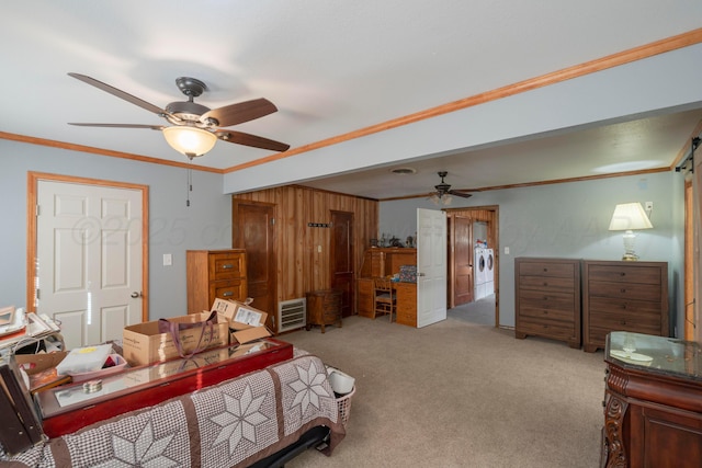 bedroom featuring light carpet, washer / clothes dryer, and crown molding