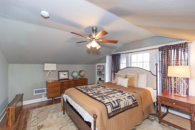 bedroom featuring vaulted ceiling, light wood-style floors, ceiling fan, and baseboards