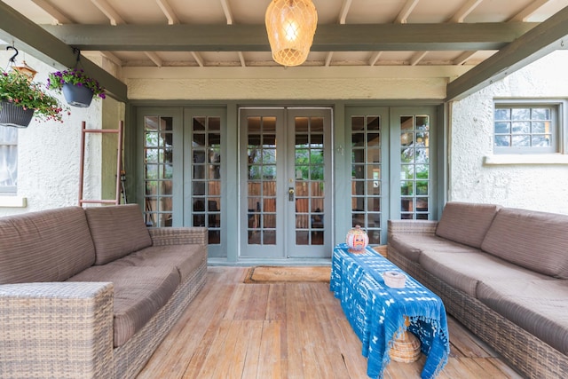 view of patio / terrace with french doors, an outdoor living space, and a wooden deck