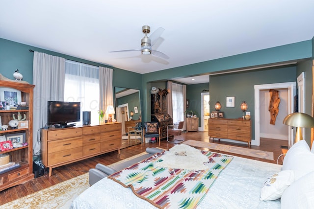 bedroom featuring wood finished floors and a ceiling fan