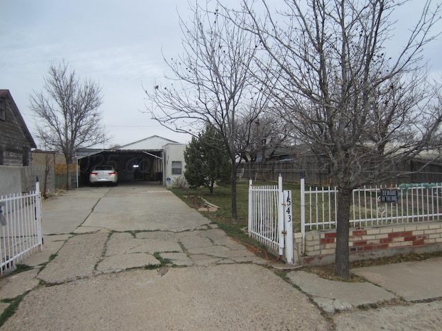 1543 SE 16th Ave, Amarillo, TX 79102 - view of road featuring a gate, a gated entry, and aphalt driveway