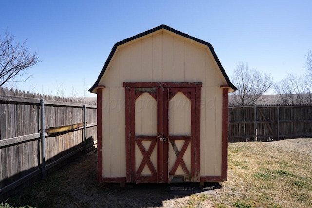view of shed with a fenced backyard