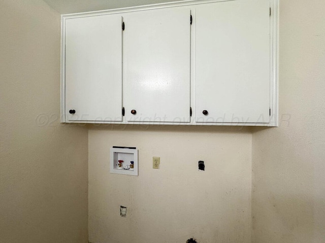 washroom featuring cabinet space and washer hookup