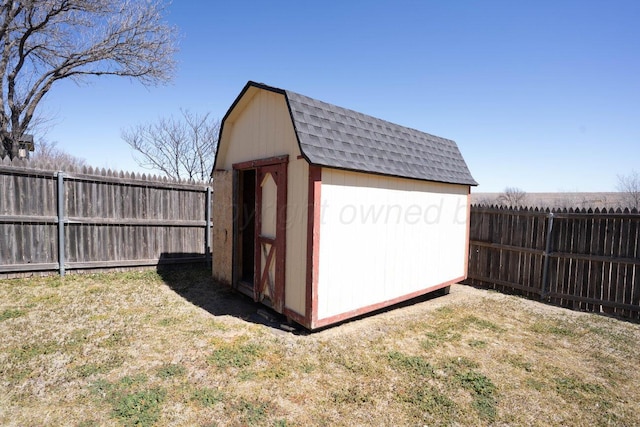 view of shed featuring a fenced backyard