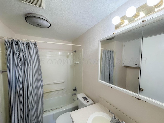 full bathroom featuring visible vents, toilet, vanity, shower / tub combo with curtain, and a textured ceiling