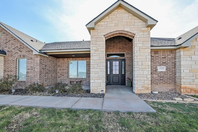 view of front of home with a garage, an outdoor structure, and a front yard