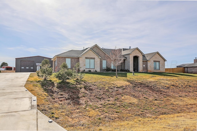 view of front facade with a front yard and a garage