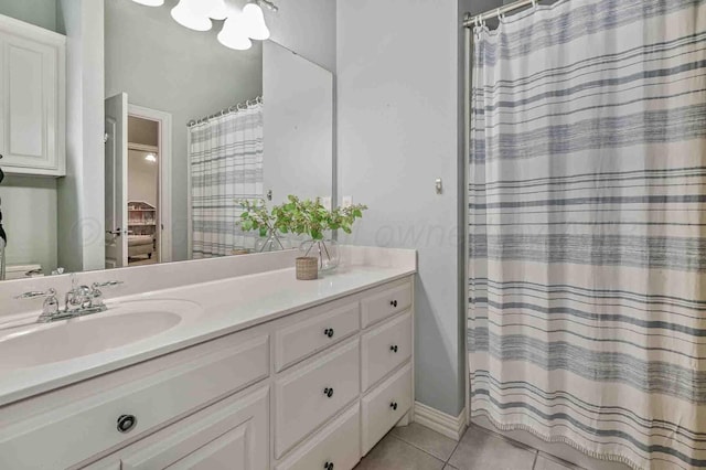 full bath with tile patterned floors, vanity, and a shower with curtain