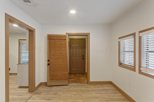 431 Crest, Pampa, TX 79065 - corridor featuring light wood finished floors, plenty of natural light, baseboards, and recessed lighting