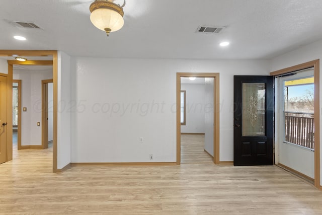 431 Crest, Pampa, TX 79065 - empty room featuring light wood-style flooring, baseboards, and recessed lighting