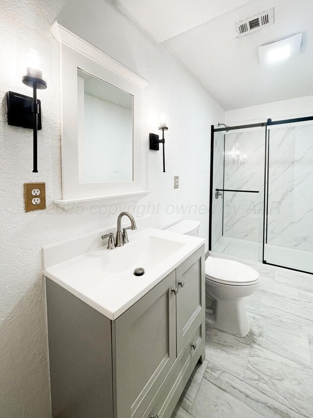431 Crest, Pampa, TX 79065 - bathroom with marble look tiles, vanity, a marble finish shower, toilet, and a textured wall