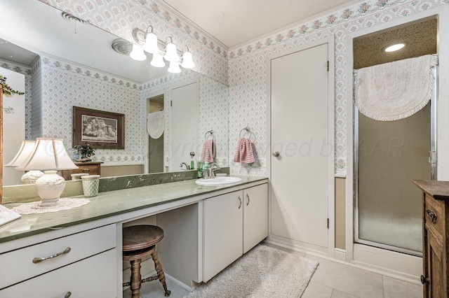 227 Ranger St, Hereford, TX 79045 - bathroom featuring a stall shower, vanity, wallpapered walls, tile patterned flooring, and baseboards