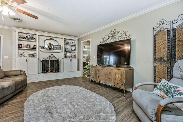 227 Ranger St, Hereford, TX 79045 - living area with a ceiling fan, crown molding, a fireplace, wood finished floors, and built in features