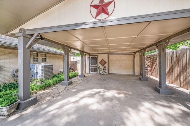 227 Ranger St, Hereford, TX 79045 - view of patio with cooling unit and an attached garage