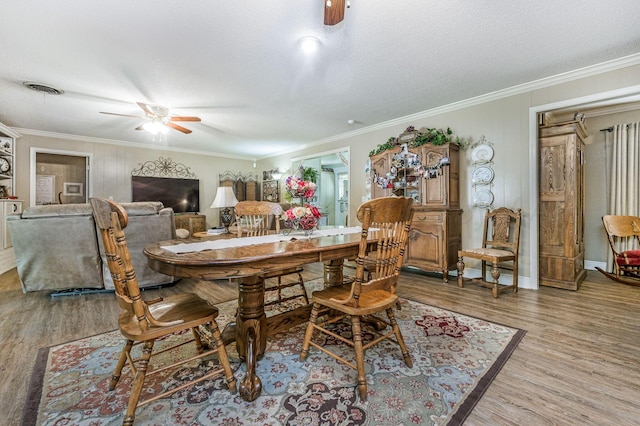 227 Ranger St, Hereford, TX 79045 - dining area with ceiling fan, wood finished floors, a textured ceiling, and ornamental molding