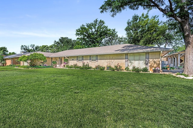 227 Ranger St, Hereford, TX 79045 - ranch-style home featuring brick siding and a front yard