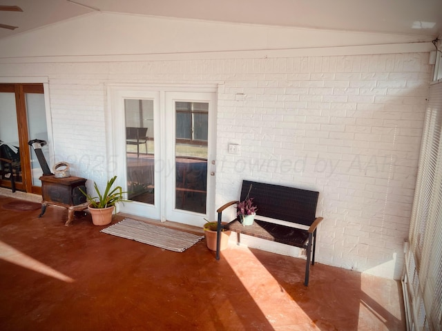 145 Pioneer Dr, Booker, TX 79005 - sunroom / solarium featuring a wood stove