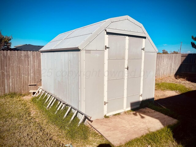 145 Pioneer Dr, Booker, TX 79005 - view of shed with a fenced backyard