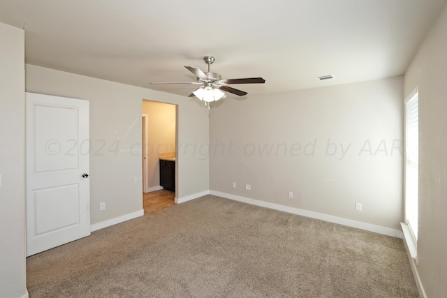 carpeted empty room with ceiling fan